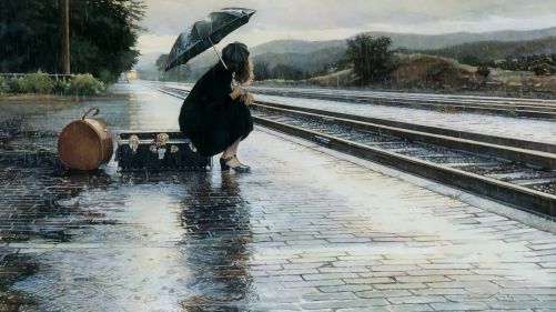 Waiting for a train in the rain